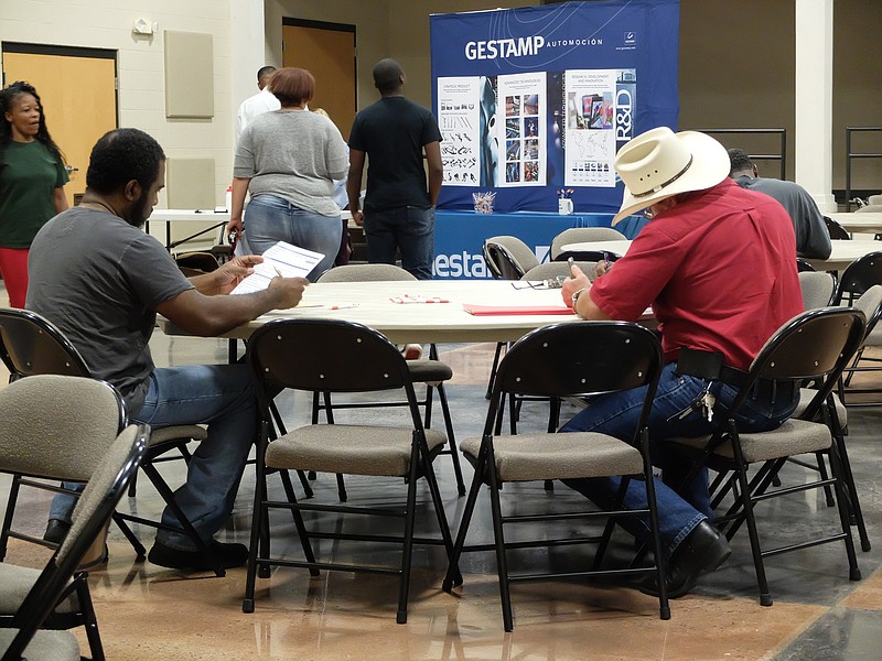 Job Fair hopefuls fill out applications for employment at Gestamp in Chattanooga. The availability was on Tuesday at the Brainerd Crossroads building.