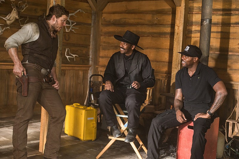 
              In this image released by MGM/Columbia Pictures, actors Chris Pratt, left, and Denzel Washington, center, appear on the set with director Antoine Fuqua during the filming of "The Magnificent Seven." The film will have its world premiere as the opening film of the 41st Toronto International Film Festival. (Sam Emerson/MGM/Columbia Pictures via AP)
            