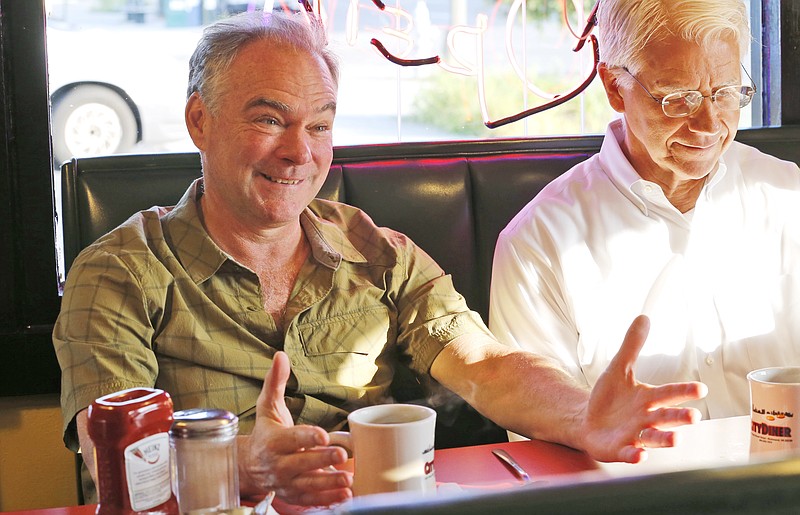 
              Democratic vice presidential candidate Sen. Tim Kaine, D-Va., left, talks with friends as he has breakfast at a diner in Richmond, Va., Tuesday, July 26, 2016. (AP Photo/Steve Helber)
            