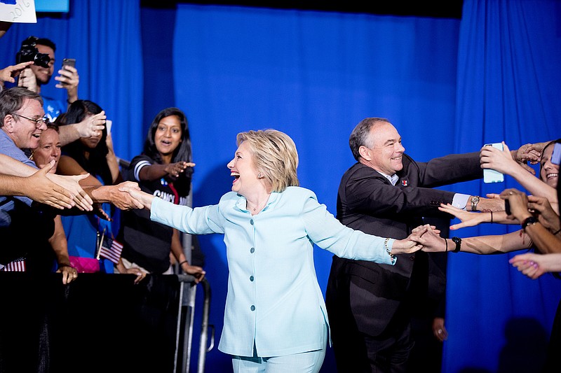 Democratic presidential candidate Hillary Clinton and Sen. Tim Kaine, D-Va., arrive together at a rally at Florida International University Panther Arena in Miami, Saturday, July 23, 2016. Clinton has chosen Kaine to be her running mate. 