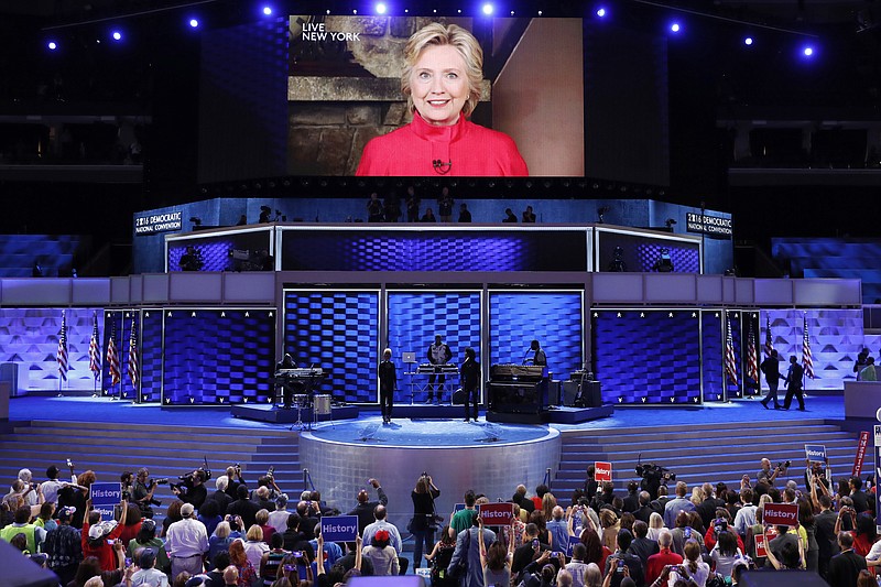 Democratic Presidential candidate Hillary Clinton appears on a large monitor to thank delegates during the second day of the Democratic National Convention in Philadelphia on Tuesday, July 26, 2016.