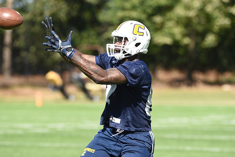 Duke Ethridge catches a pass during a UTC spring practice this year. Ethridge, who played basketball the past two seasons, will now line up at tight end for the Mocs.