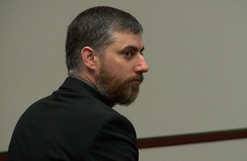 
              In an undated image from video, former Portsmouth, Va. police officer Stephen Rankin sits in court in Portsmouth, Va. Rankin is charged with first-degree murder and use of a firearm in the commission of a felony in the April 2015 death of 18-year-old William Chapman II in the parking lot of a Wal-Mart in Portsmouth, Va. Rankin's trial on charges of first-degree murder and use of a firearm in the commission of a felony is scheduled to begin Wednesday, July 27, 2016. (WVEC TV via AP, Pool)
            