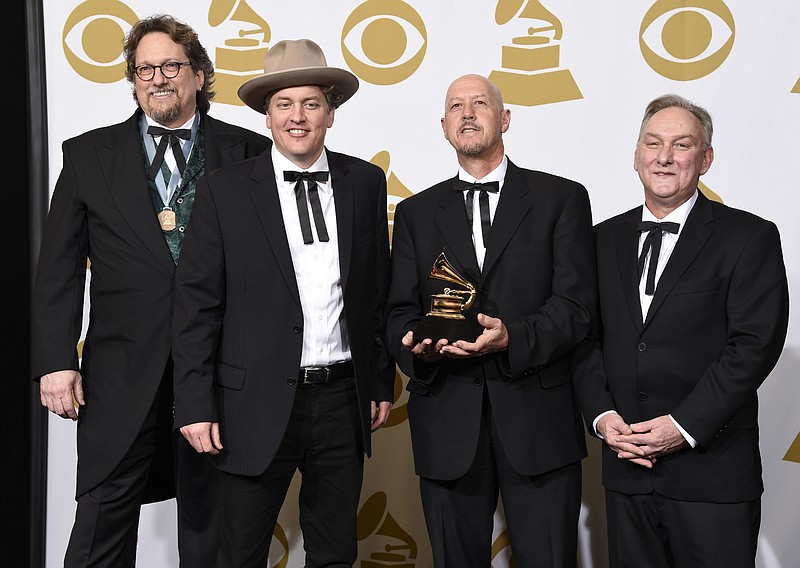 
              FILE - In this Feb. 8, 2015 file photo, Jerry Douglas, from left, Shawn Camp, John Warren and Charlie Cushman, of The Earls Of Leicester, pose in the press room with the award for best bluegrass album for "The Earls Of Leicester" at the 57th annual Grammy Awards in Los Angeles. The band os nominated for eight awards individually and as a group, including entertainers of the year, at this year’s International Bluegrass Music Awards. The awards show will be held on September 29 in Raleigh, N.C. (Photo by Chris Pizzello/Invision/AP, File)
            