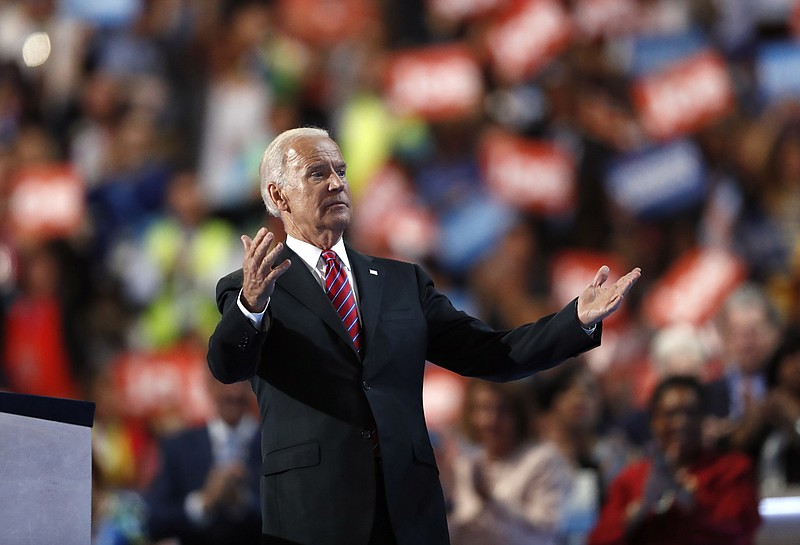 Vice President Joe Biden gestures towards wife Dr. Jill Biden, after speaking during the third day of the Democratic National Convention in Philadelphia , Wednesday, July 27, 2016. (AP Photo/Paul Sancya)