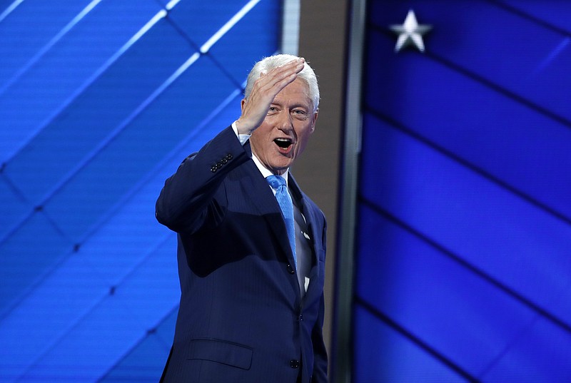 Former President Bill Clinton salutes after speaking to the delegates during the second day session of the Democratic National Convention in Philadelphia, Tuesday, July 26, 2016.