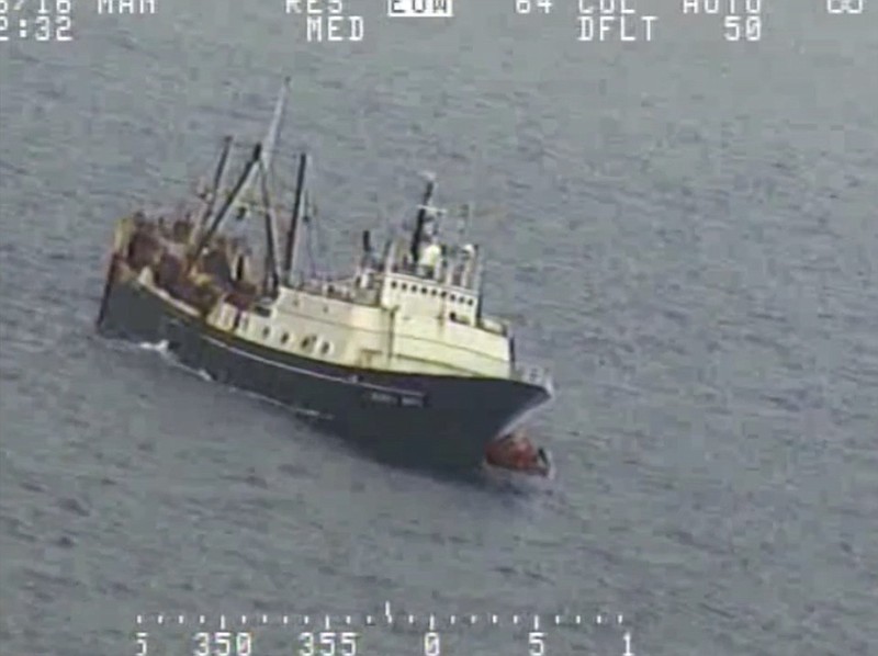 
              In this Tuesday, July 26, 2016 frame from video provided by the U.S. Coast Guard, crew from a sinking fishing boat, left, board life rafts off Alaska's Aleutian Islands in the Bering Sea. When the Alaska Juris started taking on water Tuesday, crew members donned survival suits and got into rafts. (U.S. Coast Guard via AP)
            