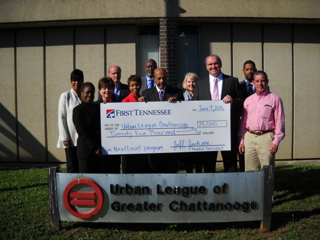 Jeff Jackson, third from right, First Tennessee Bank's Chattanooga market president, and Tracee Smith, front row at far left, First Tennessee community development manager, presented a $25,000 check to the Urban League of Greater Chattanooga to help fund the league's 
NextLevel Chattanooga program. NextLevel is a seven-month entrepreneurship program that uses the StreetWise MBA curriculum to teach new business owners leadership skills and train them on how to put their growth plans into action. At the presentation are, front row from left, Smith, Diana Bulloch, Tanjela Johnson, Urban League President Warren Logan, Jackson and Albert Waterhouse. In back are, from left, Cheryl Key, Dr. Dan Challener, Dr. Kirk Kelley, Sandy Poi and Dr. Ernest Reid.