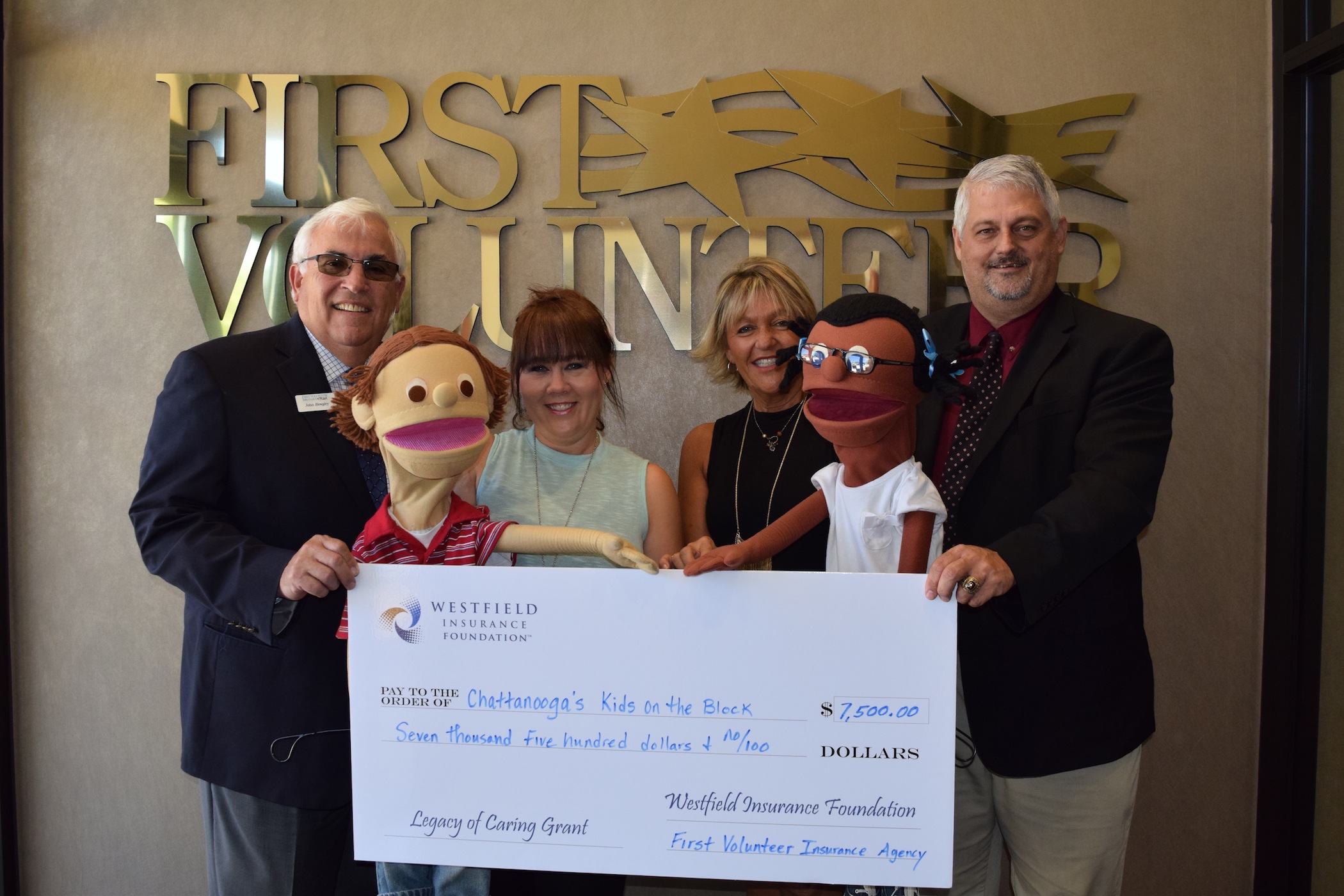 Kids on The BlockChattanooga Kids on the Block has received a $7,500 donation from Westfield Foundation with the assistance of First Volunteer Insurance Agency. The grant is part of the new Westfield Legacy of Caring program, in which Westfield agencies across the country may nominate a local nonprofit whose mission is either disaster relief, insurance pathways, family stability or safety. Kids on the Block was one of 45 nonprofit agencies nationwide to receive a grant. From left are John Hewgley, First Volunteer Insurance Agency president; Kelly Lowry, Kids on the Block marketing director; Kelly Williams, Kids on the Block executive director; and Mike Owen, First Volunteer insurance agent.