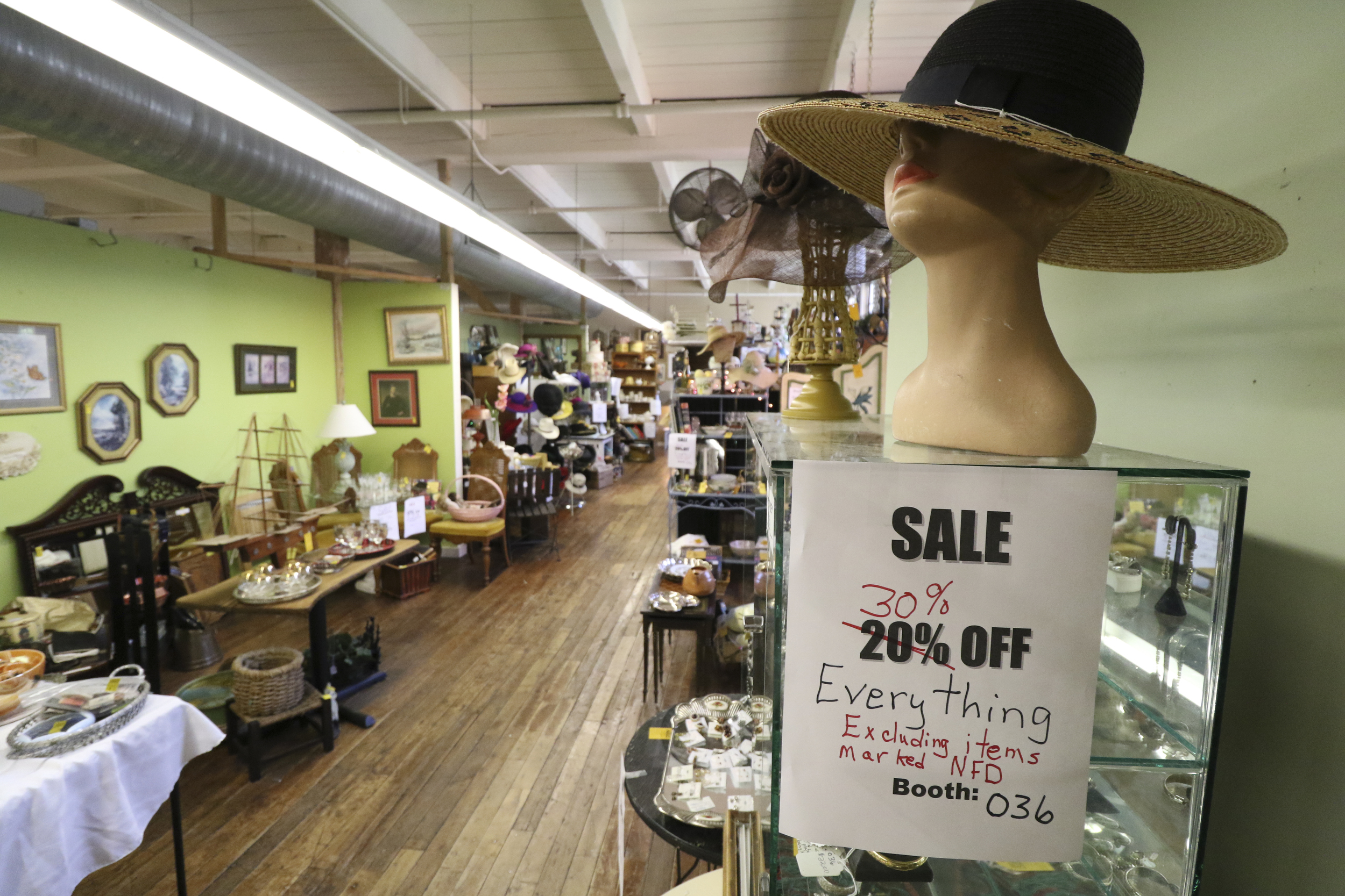 Staff Photo by Dan Henry / The Chattanooga Times Free Press- 7/27/16. Vendors inside of Knitting Mill Antiques are discounting merchandise after the building was recently purchased and will become the Signal Mill office and retail development complex.