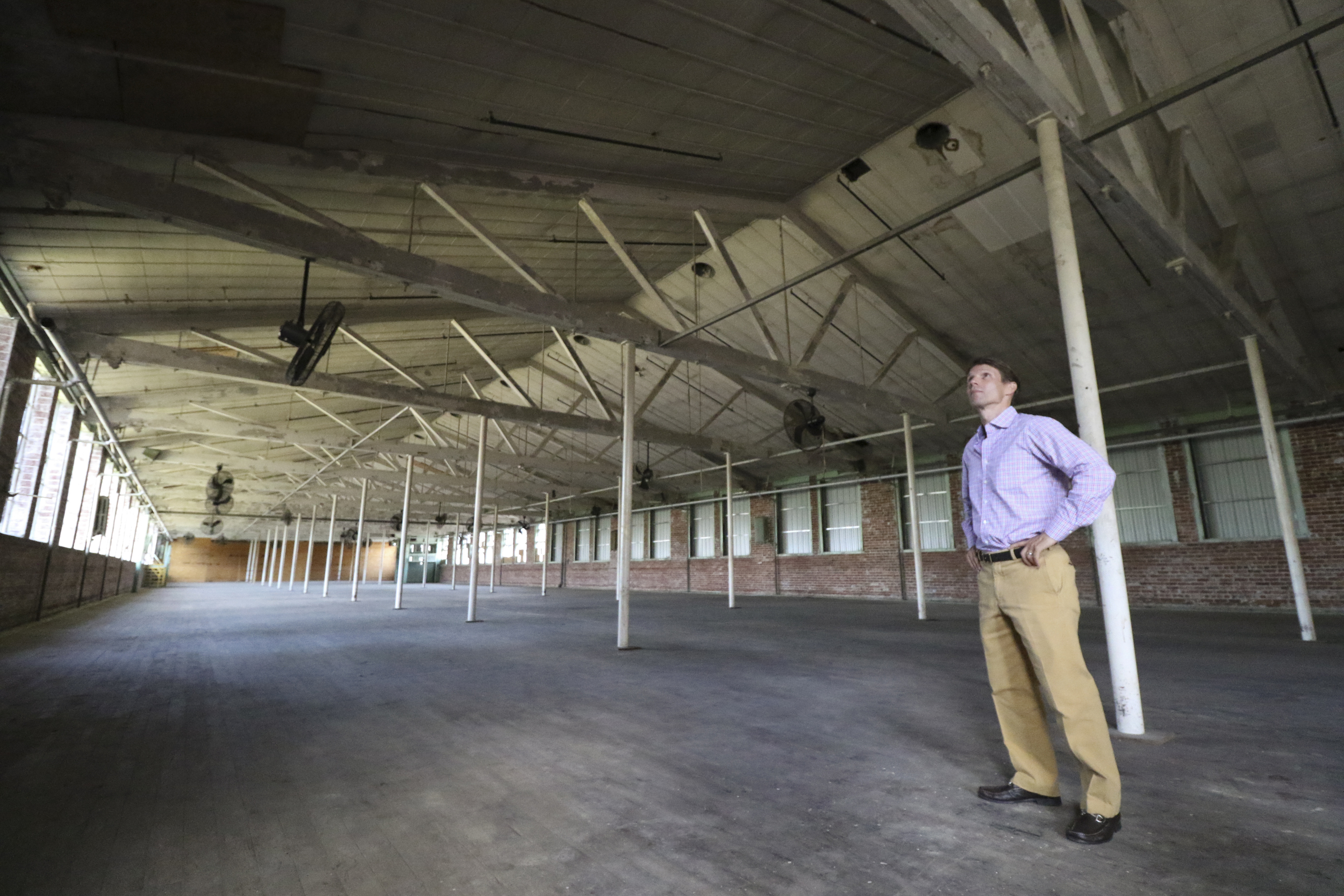 Staff Photo by Dan Henry / The Chattanooga Times Free Press- 7/27/16. David Woodbery, developer and owner of the future Signal Mill office and retail development, speaks about his recent acquisition of the building where Knitting Mill Antiques currently resides and what he plans to do to it on Wednesday, July 27, 2016.