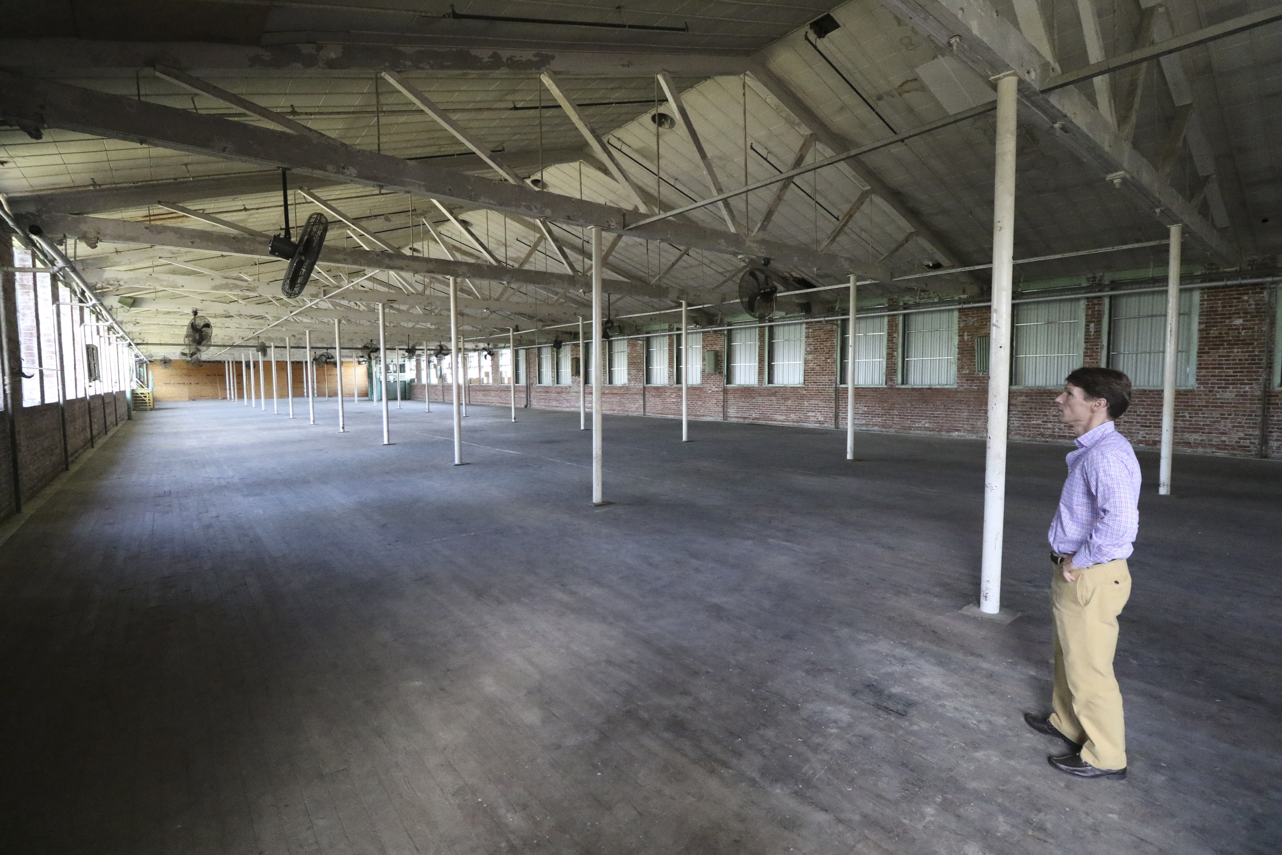 Staff Photo by Dan Henry / The Chattanooga Times Free Press- 7/27/16. David Woodbery, developer and owner of the future Signal Mill office and retail development, speaks about his recent acquisition of the building where Knitting Mill Antiques currently resides and what he plans to do to it on Wednesday, July 27, 2016.