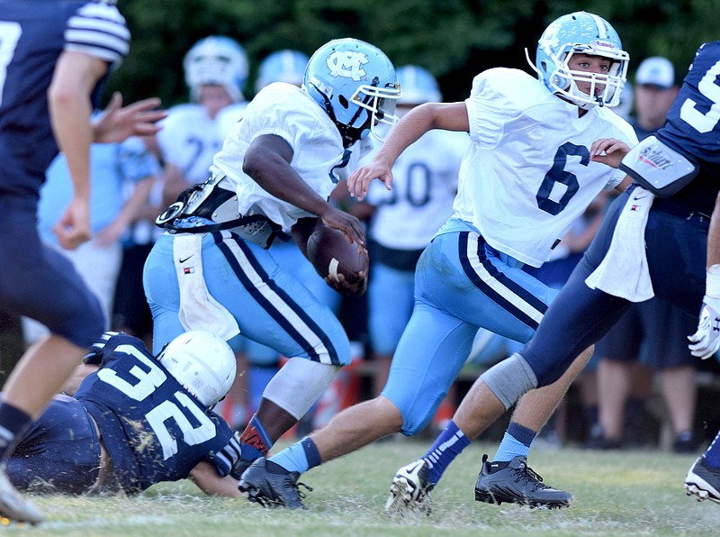 McMinn Central's Jackson Long (3) picks up yards around left end.  Five area high schools scrimmaged at Bradley Central High School Saturday, August 1, 2015.