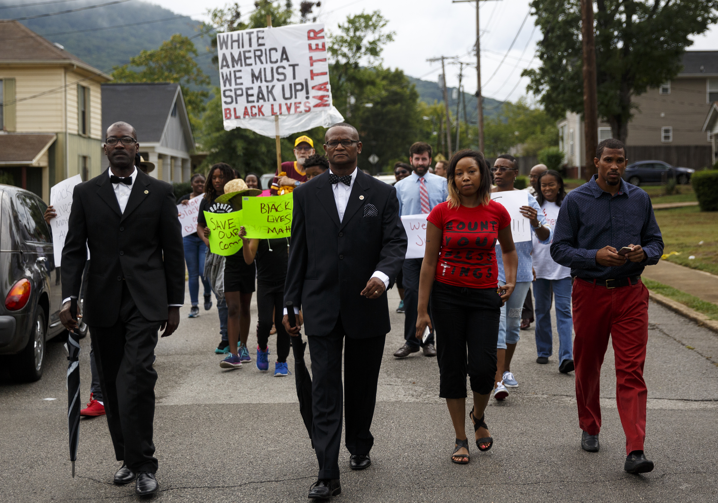 Demonstrators march from South Chattanooga Recreation Center to Westside Baptist Church before a town hall meeting at the church to discuss race relations and poverty Thursday, July 28, 2016, in Chattanooga, Tenn. A panel of speakers took part in a discussion about race, poverty, and policing.