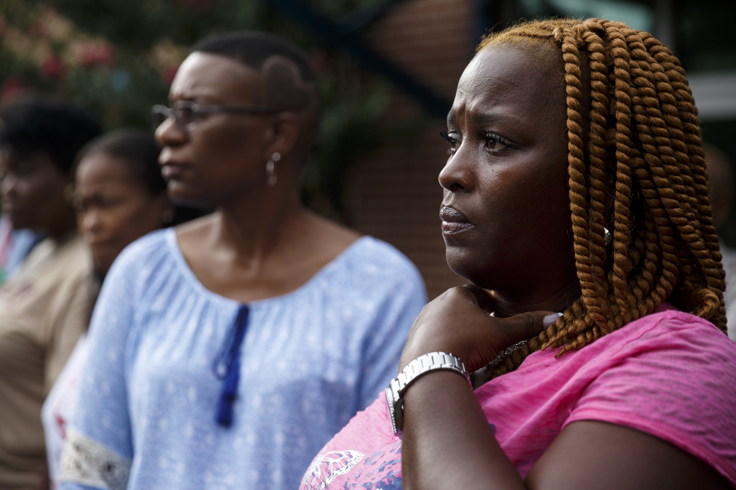 Valerie Yancey, right, and Yolanda Jones listen as a march from South Chattanooga Recreation Center to Westside Baptist Church is prepared before a town hall meeting at the church to discuss race relations and poverty Thursday, July 28, 2016, in Chattanooga, Tenn. A panel of speakers took part in a discussion about race, poverty, and policing.