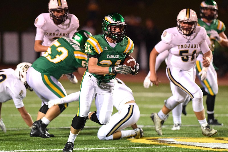 Rhea County's Cody Bice (21) breaks into the open.  The Soddy-Daisy Trojans visited the Rhea County Golden Eagles in aTSSAA football game on Friday, October 16, 2015.