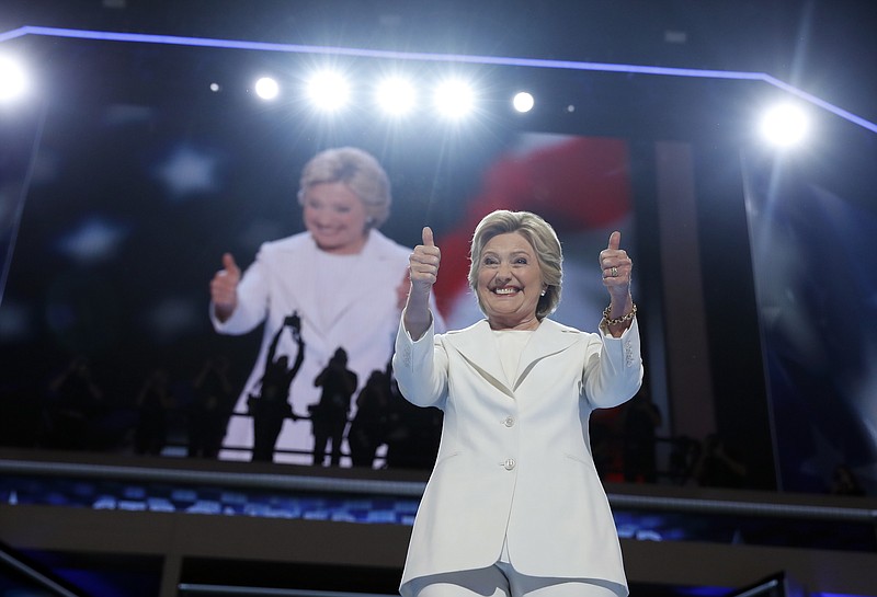Democratic presidential nominee Hillary Clinton gives her thumbs up as she appears on stage during the final day of the Democratic National Convention in Philadelphia, Thursday, July 28, 2016. (AP Photo/Carolyn Kaster)