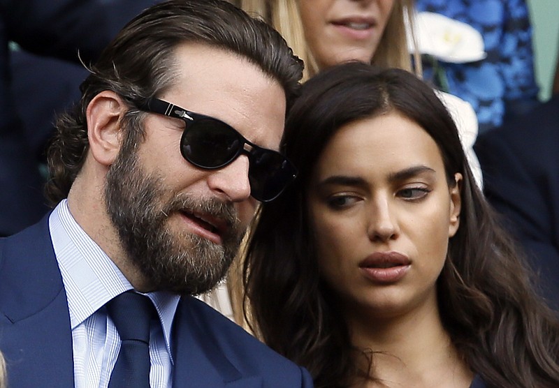 
              FILE - In this July 10, 2016, file photo, actor Bradley Cooper, left, speaks with his girlfriend model Irina Shayk on the fourteenth day of the Wimbledon Tennis Championships in London. Cooper and Shayk were spotted by TV cameras at the 2016 Democratic National Convention in Philadelphia Wednesday, July 28, 2016. His appearance has drawn ire among conservative fans of his 2014 hit, "American Sniper." (AP Photo/Kirsty Wigglesworth, File)
            