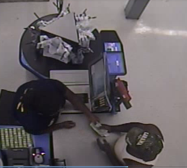 On Friday, July 8, two fraudulent checks were cashed at separate times at the Brainerd and Cummings Highway Walmarts. This man on the right is a suspect.