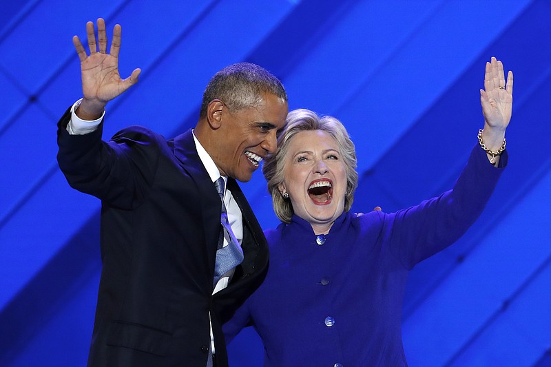 
              President Barack Obama and Democratic Presidential nominee Hillary Clinton wave to delegates after President Obama's speech during the third day of the Democratic National Convention in Philadelphia , Wednesday, July 27, 2016. (AP Photo/J. Scott Applewhite)
            