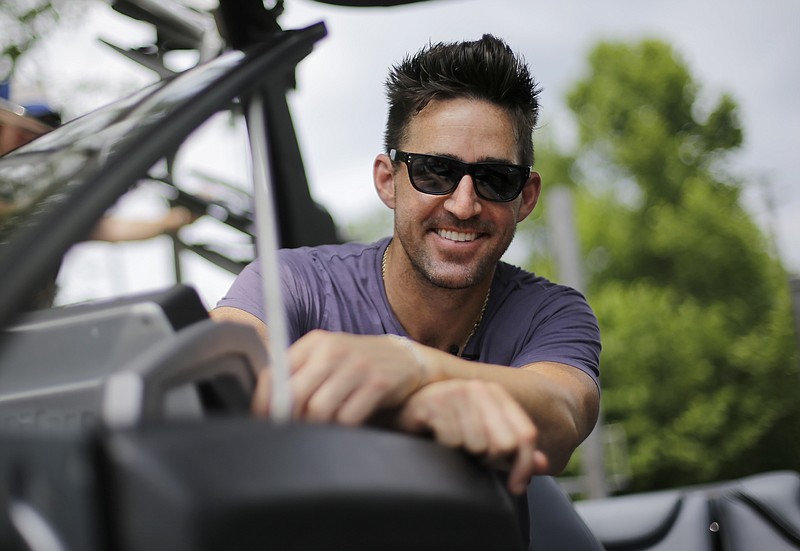 
              In this June 21, 2016 photo, Country music star Jake Owen poses in his boat on the Cumberland River near Nashville, Tenn. Owen's latest album, "American Love," comes out on Friday, July 29. (AP Photo/Mark Humphrey)
            