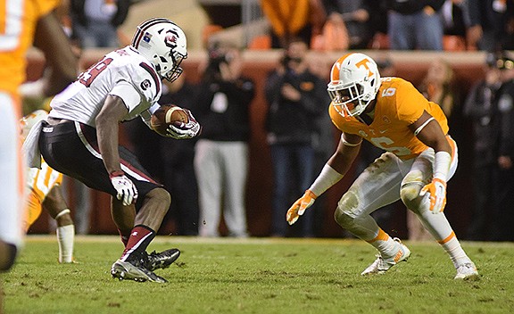 Tennessee's Todd Kelly Jr. prepares to hit South Carolina's Jerell Adams (89).  Adams would fumble on the play sealing the 27-24 victory for Tennessee.  The South Carolina Gamecocks visited the Tennessee Volunteers in SEC football action November 7, 2015.