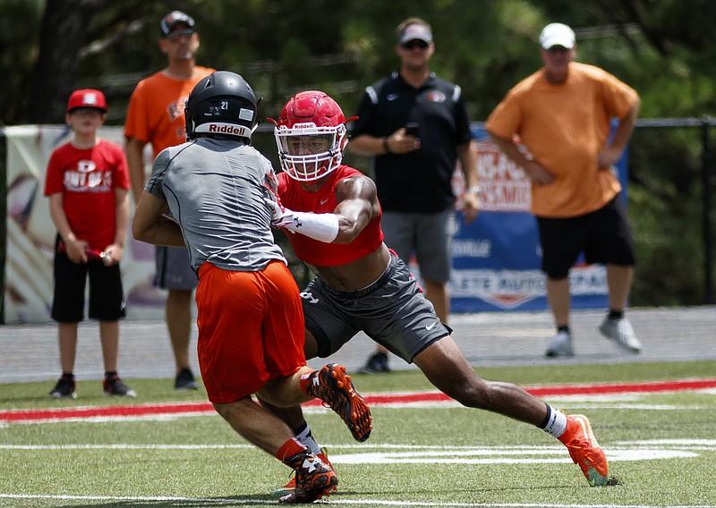 Dalton defender Kyric McGowan tags a Ryle player during their game against Ryle High School at the Southeastern 7 on 7 Championships on Friday, July 15, 2016, in Dalton, Ga.