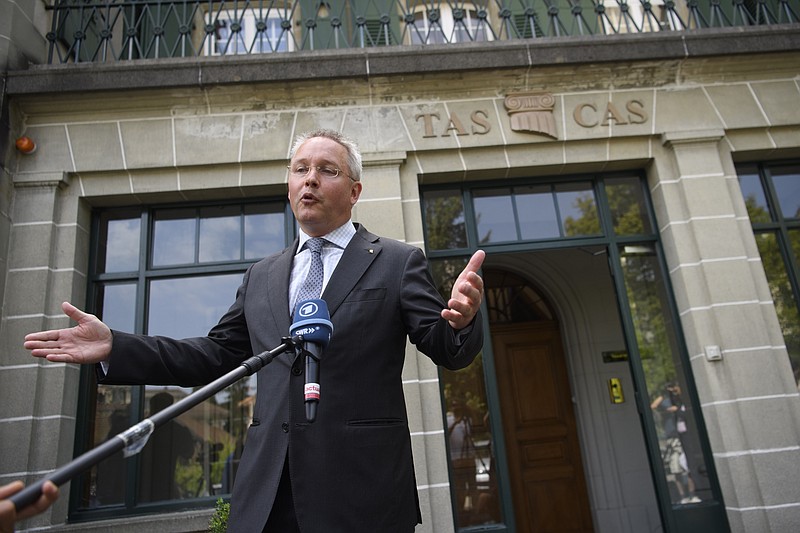 Matthieu Reeb, General Secretary of the Court of Arbitration for Sport, CAS, speaks to journalists during the release of the decision in the case between the Russian Olympic Committee (ROC), 68 Russian athletes and the International Association of Athletics Federations (IAAF) in front of the Court of Arbitration for Sport (CAS) in Lausanne, Switzerland, Thursday, July 21, 2016.