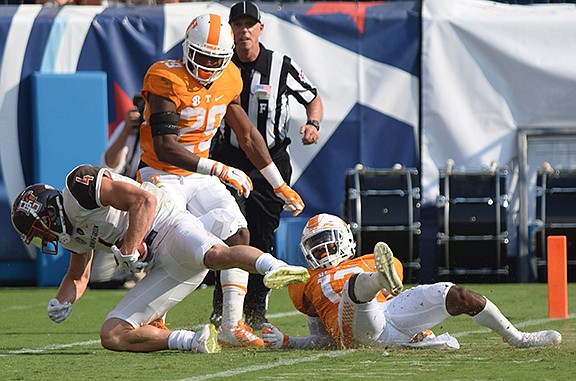 Bowling Green's Gehrig Dieter is driven out of bounds by Tennessee's Evan Berry, center, and Malik Foreman after a long pass reception during last season's opener at Nissan Stadium in Nashville. Berry led the nation in kickoff return average last season and helped make special teams one of the Vols' biggest assets.