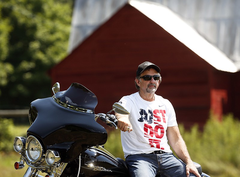 
              In this Wednesday, July 13, 2016 photo, Jeffrey Monsour poses outside his home in Lake Luzerne, N.Y. Some caretakers for disabled New Yorkers say they've been harassed and punished for making complaints about potentially hazardous situations at state facilities.  Monsour is one who is  pursuing a federal lawsuit alleging their complaints prompted supervisors to retaliate with trumped-up accusations of wrongdoing that forced them to be placed on paid leave. Monsour, a 17-year state employee, says he’s currently on at least his sixth such leave, totaling more than a year and a half of his career.  (AP Photo/Mike Groll)
            