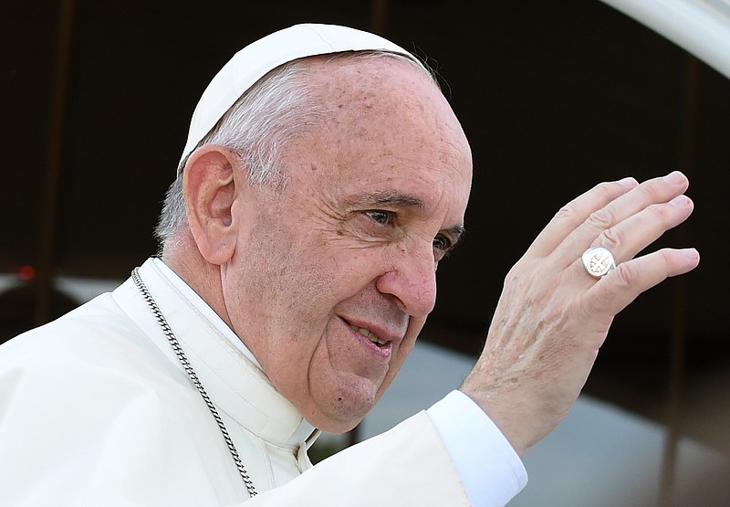 
              Pope Francis greets faithful as he arrives at the Shrine of Divine Mercy in Krakow, Poland, Saturday, July 30, 2016, on the fourth day of his visit to Poland. (AP Photo/Alik Keplicz)
            