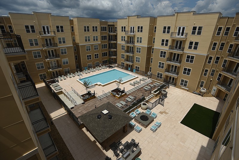Douglas Heights apartments feature a pool and outdoor seating Friday, July 29, 2016.