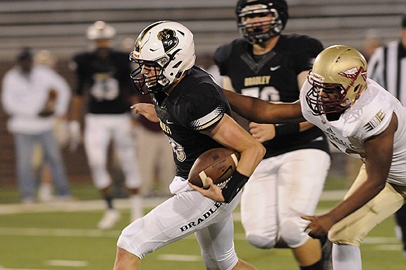 Bradley Central quarterback Cole Copeland breaks free from a Riverdale defender last season. On Sunday, Copeland became the fifth player to commit to UTC for its 2017 recruiting class.