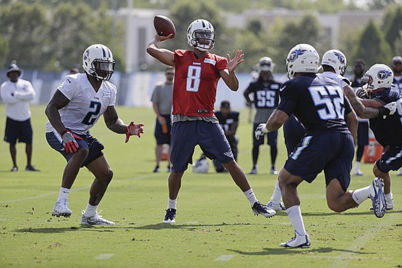 Tennessee Titans quarterback Marcus Mariota passes during Saturday's practice in Nashville.