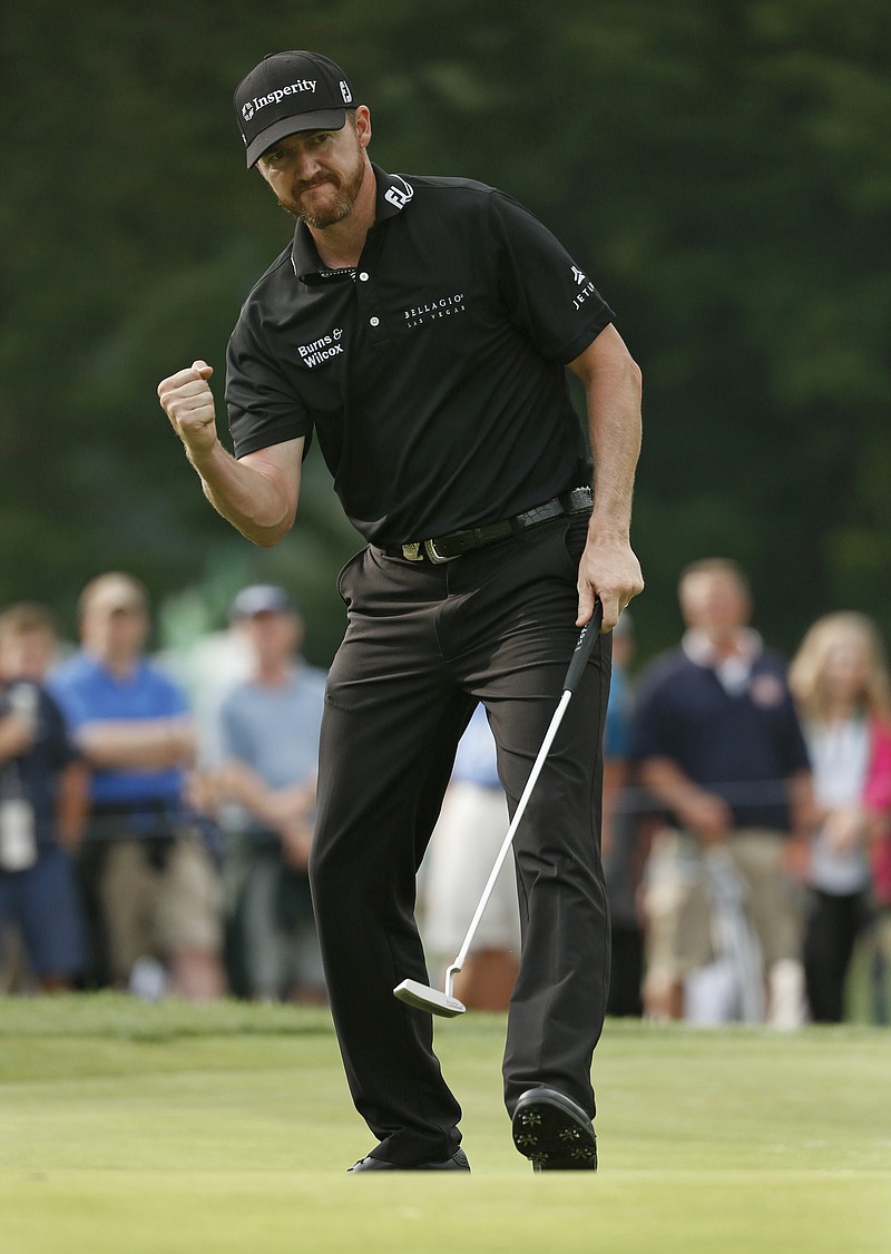 Jimmy Walker reacts to his birdie putt on the 11th hole during the final round of the PGA Championship golf tournament at Baltusrol Golf Club in Springfield, N.J., Sunday, July 31, 2016. (AP Photo/Mike Groll)