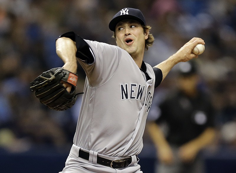 
              FILE - In a Friday, May 27, 2016 file photo, New York Yankees relief pitcher Andrew Miller delivers to the Tampa Bay Rays during the eighth inning of a baseball game in St. Petersburg, Fla. A person familiar with the trade says Sunday, July 31, 2016, that the Cleveland Indians have acquired left-hander Miller from the New York Yankees. (AP Photo/Chris O'Meara, File)
            