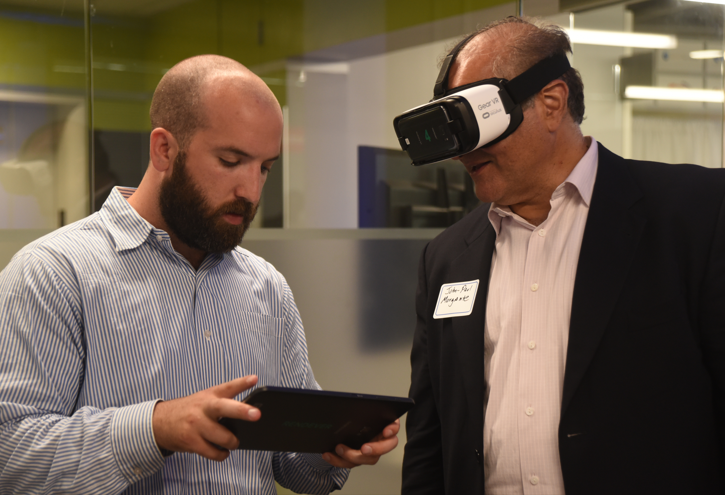 Reed Hayes, with Rendever, demonstrates his product to John-Paul Morgante. The startup company plans to sell assisted living centers virtual reality goggles and Rendever's software platform so seniors who can't travel can virtually visit exotic locations, see their childhood neighborhoods via Google street view and take part in family occasions, such as weddings.
