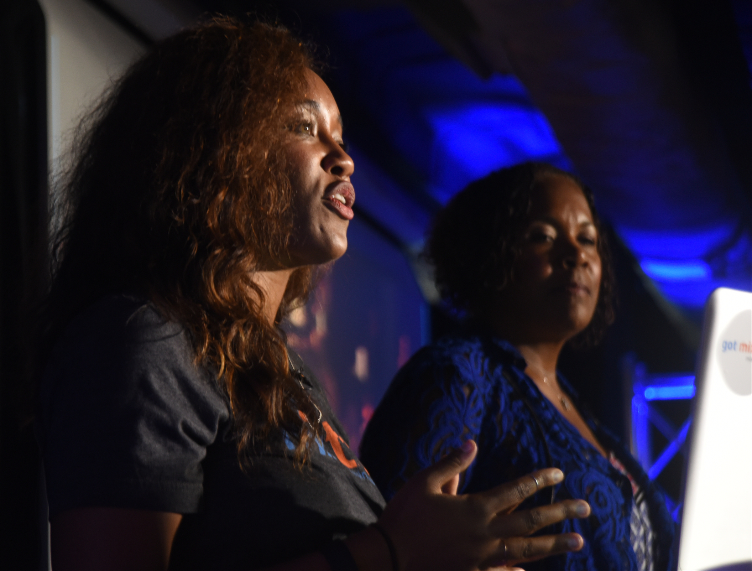 Kerry Schrader, right, and daughter Ashlee Schrader talk about Mixtroz, a mobile app that allows individuals in large settings to connect in smaller, more intimate groups for face-to-face introductions.