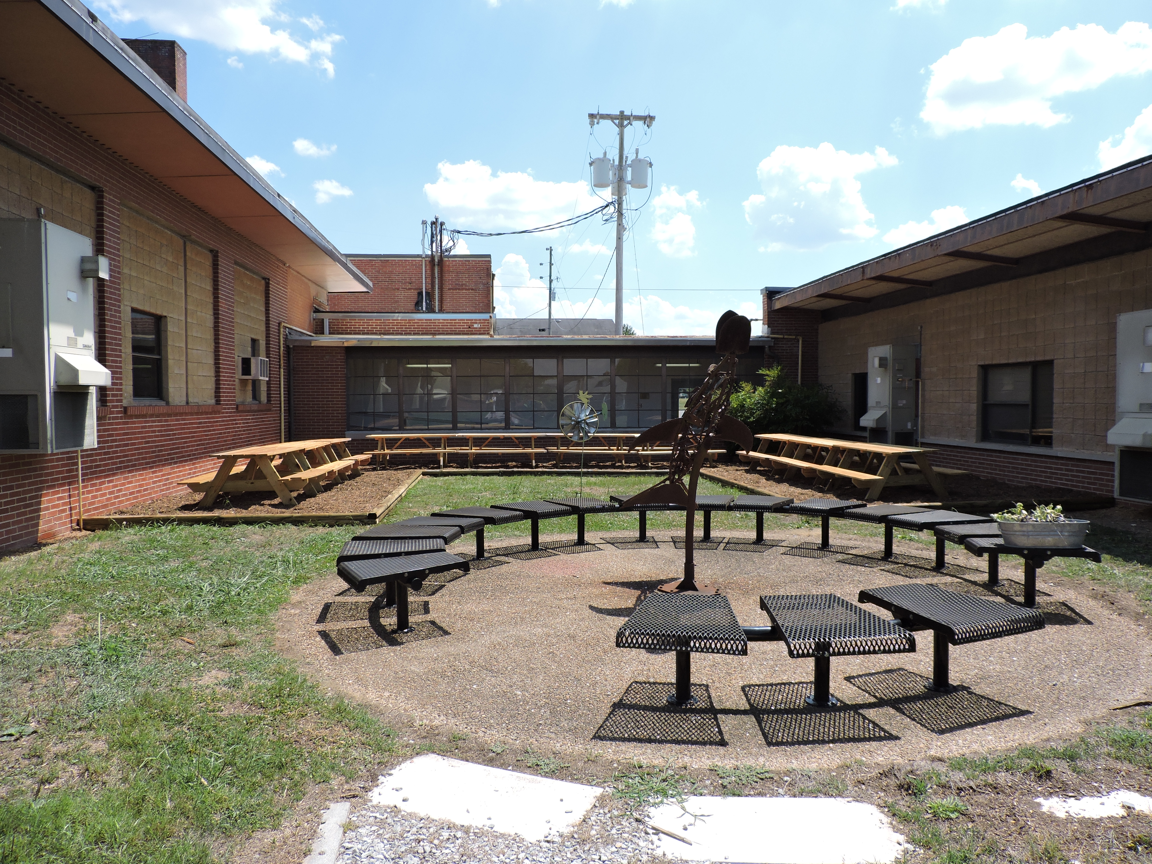 The courtyard at the Performance Learning Center got a facelift with all new picnic tables donated by local businesses.