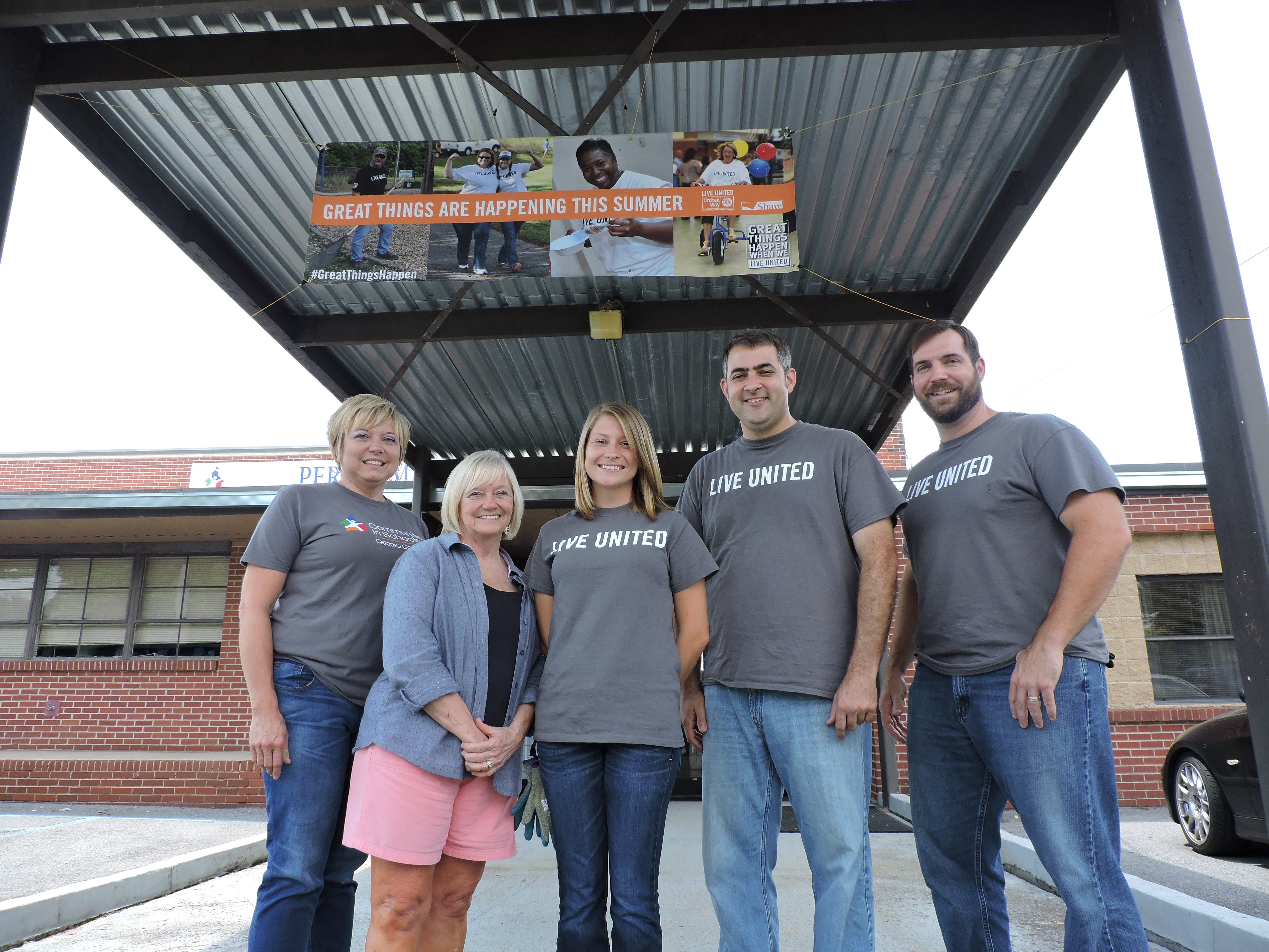 Shaw Industries supervisors partner with Communities in Schools and the PLC for renovations to the school. From left are CIS Executive Director Suzanne Chovanec, PLC Principal Sharon Vaughn, and Laura Porter, Justin Williams and Jack Cash of Shaw.