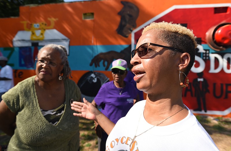 Cora Lanier, right, and Dr. Everlena Holmes talk outside of Frozen TNT Cafe on Dodson Avenue Monday, August 1, 2016.