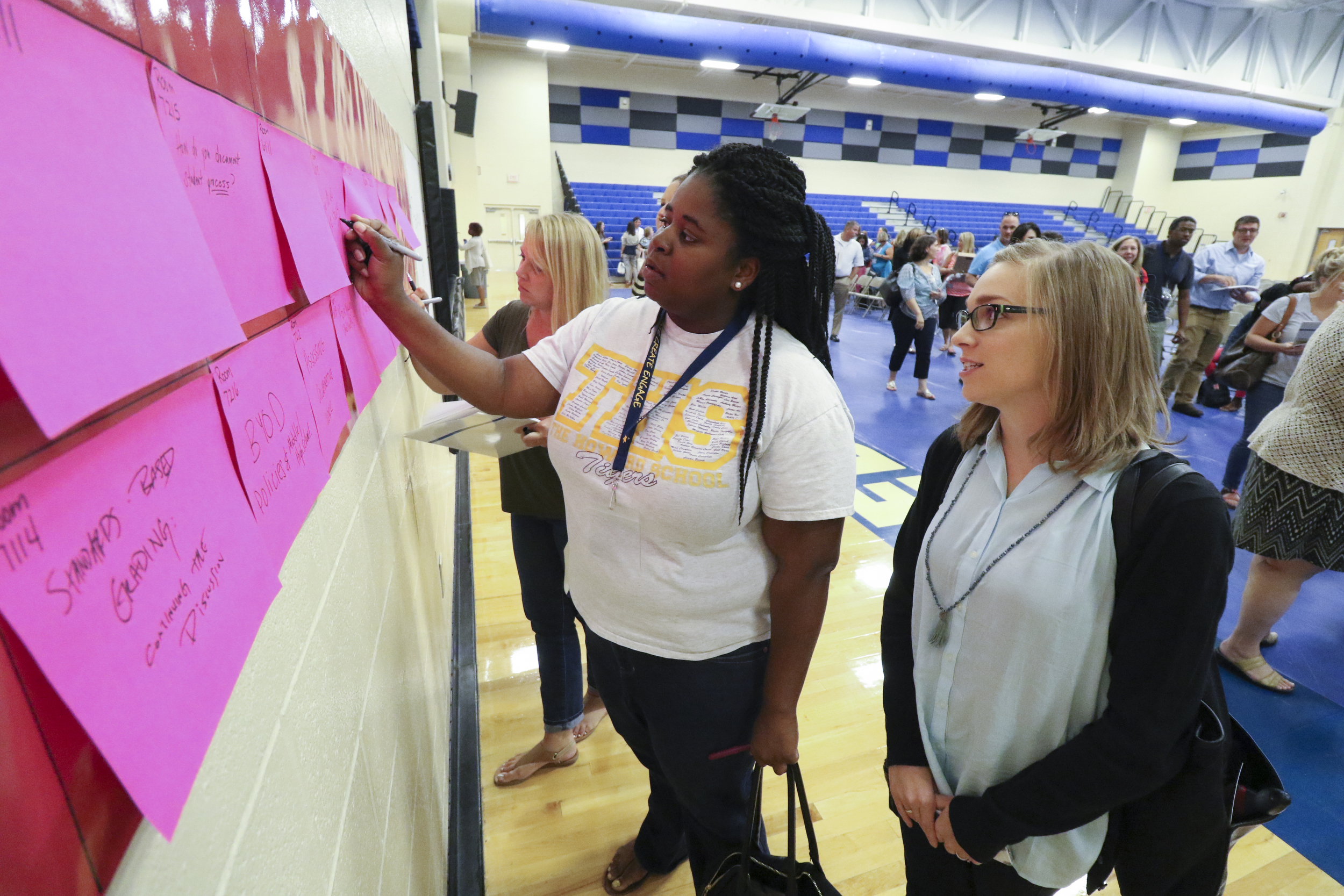 Staff Photo by Dan Henry / The Chattanooga Times Free Press- 8/1/16. Howard School teachers Ashley Cox, left, and Sydney Hester sign up for a break out session during the I.C.E. Institute (Innovate Create Engage) held at Red Bank Middle School on Monday, August 1, 2016.