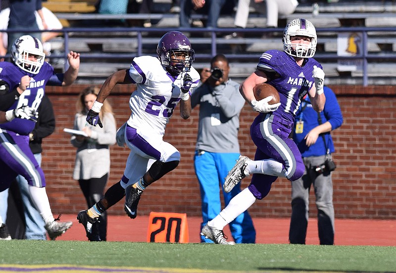 Marion County's Hunter Zeman (11) breaks free on a 45 yard run in the third quarter.  The Marion County Warriors faced the Trezevant Bears in the Division I Class 2A Tennessee State Football Championships in the BlueCross Bowl at Tennessee Tech's Tucker Stadium on Saturday, December 5, 2015.