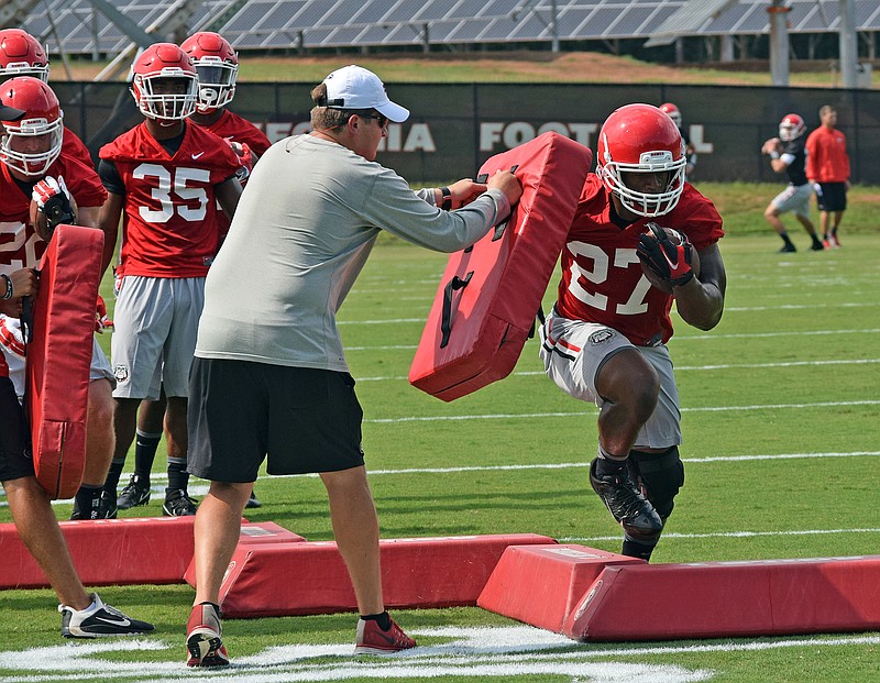 Georgia junior tailback Nick Chubb wore a knee brace but was able to go through Monday afternoon's opening practice in Athens.