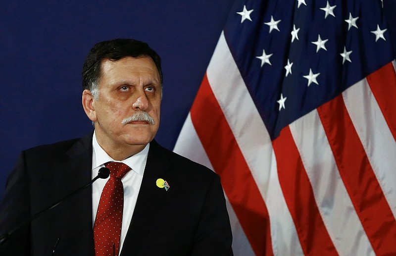 In this May 16, 2106 file-pool photo, Fayez al-Sarraj, the head of the U.N.-brokered presidency council, attends a news conference in Vienna, Austria. The U.S. launched multiple airstrikes against Islamic State militants Monday, Aug. 1, 2016, opening a new, more persistent front against the group at the request of the UN-backed Libyan government, Libyan and U.S. officials said. Serraj, said in a televised statement that American warplanes attacked the IS bastion of Sirte. No U.S. ground forces will be deployed, he said. (Leonhard Foeger/Pool Photo via AP, File)