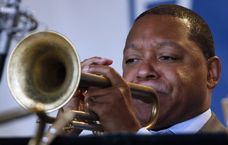 
              FILE - In this Saturday, Aug. 2, 2014 file photo, Wynton Marsalis performs with Jazz at Lincoln Center Orchestra during the Newport Jazz Festival in Newport, R.I. The Rockefeller Foundation and Jazz at Lincoln Center are teaming up to put jazz in the ears of thousands of urban school children across the globe. The tour, led by Wynton Marsalis, is designed for students with limited access to arts education in grades K-12. (AP Photo/Michael Dwyer, File)
            