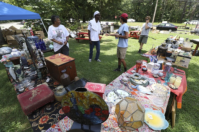 Shoppers peruse one of the many booths set up adjacent to Taft Highway atop Signal Mountain at last year's World's Longest Yard Sale, which covers 690 miles of Highway 127 and the Lookout Mountain Parkway.