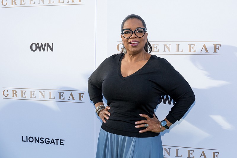 
              FILE - In this Wednesday, June 15, 2016 file photo, Oprah Winfrey arrives at the season one premiere of "Greenleaf" at The Lot in West Hollywood, Calif. Winfrey has a new book club pick, Colson Whitehead’s “The Underground Railroad,” a historical novel that imagines the network of safe houses and passages that helped slaves escape to free territory is an actual train.  (Photo by Willy Sanjuan/Invision/AP, File)
            