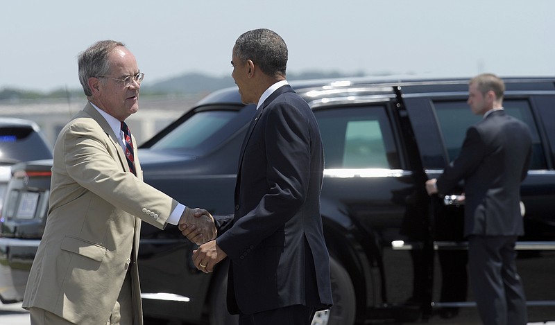 President Barack Obama is greeted by U.S. Rep. Jim Cooper, D-Tenn., after arriving on Air Force One at Chattanooga Metropolitan Airport in Chattanooga on Tuesday, July 30, 2013.