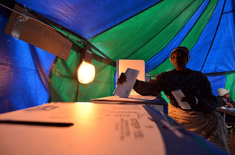 
              A woman casts her vote at a polling station in Atteridgeville, Pretoria, South Africa, Wednesday Aug. 3, 2016. South Africans are voting in municipal elections in which the ruling African National Congress seeks to retain control of key metropolitan areas despite a vigorous challenge from opposition parties. (AP Photo)
            